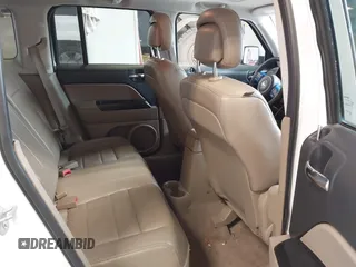 2014 Jeep Patriot Latitude with VIN 1C4NJPFA0ED680509, listed as a IAAI auction lot 41801775 with 147,418 mi miles and . Bid and sale history available at carsss.com. Image 8.