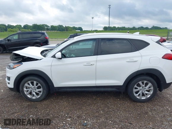 2019 Hyundai Tucson Value z VIN KM8J33A41KU013023, wystawiony jako IAAI lot #42302643 z przebiegiem 41 231 mil mil oraz . Historia ofert i sprzedaży dostępna na DreamBid. Obrazek 14.