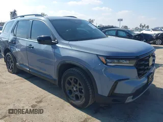 2023 Honda Pilot TrailSport with VIN 5FNYG1H64PB055172, listed as a IAAI auction lot 41458372 with 24,875 mi miles. Bid and sale history available at carsss.com. Image 1.