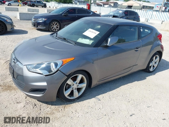 2013 Hyundai Veloster w/Gray Int with VIN KMHTC6AD9DU128725, listed as a IAAI auction lot 42648356 with 168,109 mi miles and . Bid and sale history available at DreamBid. Image 2.