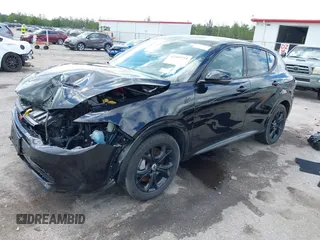 2024 Dodge Hornet R/T with VIN ZACPDFCW9R3A16217, listed as a IAAI auction lot 42589754 with 14,484 mi miles and . Bid and sale history available at DreamBid. Image 2.