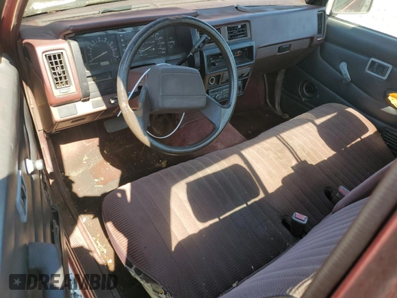 1991 Nissan Frontier XE with VIN 1N6SD11S2MC412375, listed as a Copart auction lot 61015515 with 201,629 mi miles and Salvage title. Bid and sale history available at DreamBid. Image 8.