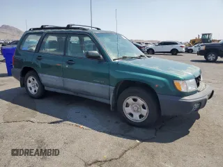 1999 Subaru Forester L with VIN JF1SF6350XG745369, listed as a Copart auction lot 64697045 with 42,522 mi miles and Clean title. Bid and sale history available at DreamBid. Image 4.