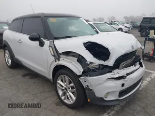 2014 MINI Paceman S with VIN WMWSS5C5XEWN67230, listed as a IAAI auction lot 41669156 with 108,931 mi miles and . Bid and sale history available at DreamBid. Image 1.