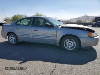 1999 Pontiac Grand Am SE2 with VIN 1G2NE52E5XM826878, listed as a Copart auction lot 77351164 with 241,463 mi miles and Salvage Title. Bid and sale history available at carsss.com. Image 4.