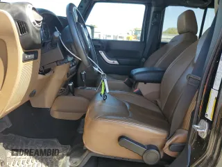 2013 Jeep Wrangler Unlimited Rubicon 10th Anniversary with VIN 1C4HJWFG4DL550832, listed as a Copart auction lot 71633684 with 60,759 mi miles and Salvage title. Bid and sale history available at DreamBid. Image 7.