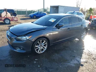 2014 Mazda 6 i Grand Touring with VIN JM1GJ1W50E1107877, listed as a IAAI auction lot 41857596 with 166,188 mi miles and . Bid and sale history available at DreamBid. Image 19.