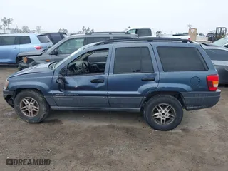2004 Jeep Grand Cherokee Laredo with VIN 1J4GX48S64C291075, listed as a IAAI auction lot 41805747 with 282,384 mi miles. Bid and sale history available at carsss.com. Image 14.