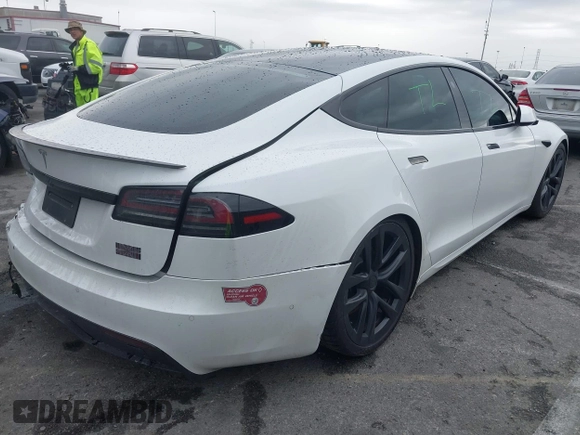 2022 Tesla Model S Plaid with VIN 5YJSA1E65NF488864, listed as a IAAI auction lot 41772788 with 33,915 mi miles and . Bid and sale history available at DreamBid. Image 4.