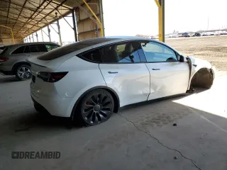2022 Tesla Model Y Performance z VIN 7SAYGDEF0NF337959, wystawiony jako Copart lot #56871985 z przebiegiem 54 527 mil mil oraz Szkoda całkowita • Salvage title. Historia ofert i sprzedaży dostępna na DreamBid. Obrazek 3.