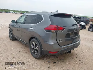 2017 Nissan Rogue SV with VIN 5N1AT2MT0HC889383, listed as a IAAI auction lot 42073498 with 319,134 mi miles and . Bid and sale history available at DreamBid. Image 3.