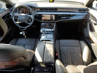 2023 Audi A8 with VIN WAULDAF86PN002950, listed as a Copart auction lot 77352374 with 4,444 mi miles and Salvage Title. Bid and sale history available at carsss.com. Image 8.