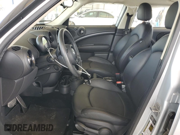 2014 MINI Countryman S with VIN WMWZC3C56EWP29211, listed as a Copart auction lot 52521145 with 91,396 mi miles and Salvage title. Bid and sale history available at DreamBid. Image 7.