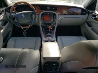 2005 Jaguar XJ with VIN SAJWA79C15SG40523, listed as a Copart auction lot 77994844 with 113,634 mi miles and Clean Title. Bid and sale history available at carsss.com. Image 8.