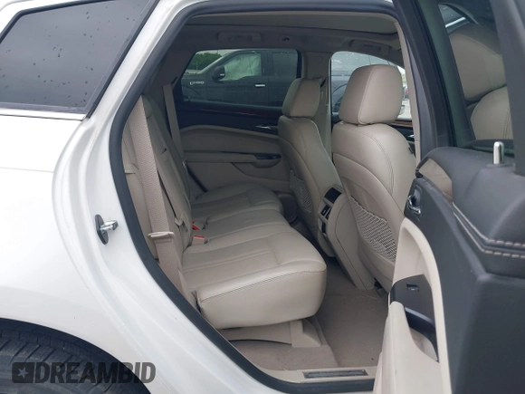 2013 Cadillac SRX Performance Collection z VIN 3GYFNHE35DS569528, wystawiony jako IAAI lot #42329652 z przebiegiem 97 184 mil mil oraz . Historia ofert i sprzedaży dostępna na DreamBid. Obrazek 8.