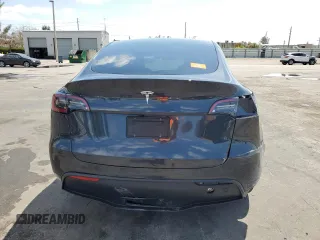 2025 Tesla Model Y Long Range with VIN 7SAYGDED8SF241779, listed as a Copart auction lot 51899205 with 12,409 mi miles and Salvage Title. Bid and sale history available at DreamBid. Image 6.