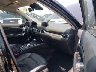 2017 Mazda CX-5 Touring with VIN JM3KFACL0H0124632, listed as a IAAI auction lot 42134971 with 107,029 mi miles and . Bid and sale history available at carsss.com. Image 5.