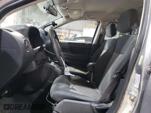 2016 Jeep Compass Sport with VIN 1C4NJCBA1GD512864, listed as a Copart auction lot 56297115 with 216,693 mi miles and Salvage title. Bid and sale history available at DreamBid. Image 7.