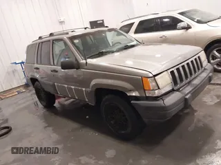 1998 Jeep Grand Cherokee Laredo with VIN 1J4GZ58S3WC343555, listed as a IAAI auction lot 41528943 with 219,146 mi miles. Bid and sale history available at carsss.com. Image 1.