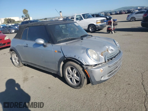 2005 MINI Convertible with VIN WMWRF33465TG10044, listed as a Copart auction lot 50364235 with 152,186 mi miles and Salvage title. Bid and sale history available at DreamBid. Image 4.