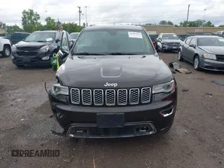 2017 Jeep Grand Cherokee Overland z VIN 1C4RJFCG7HC800403, wystawiony jako IAAI lot #42309664 z przebiegiem 98 389 mil mil oraz . Historia ofert i sprzedaży dostępna na DreamBid. Obrazek 13.