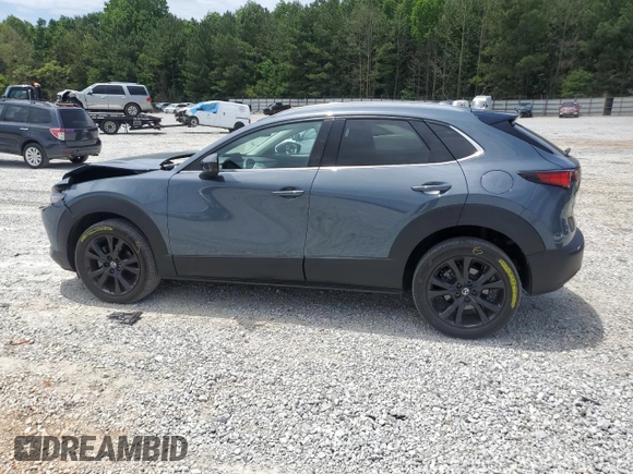 2023 Mazda CX-30 Premium with VIN 3MVDMBDY1PM509621, listed as a Copart auction lot 58316715 with 27,979 mi miles and Salvage title. Bid and sale history available at DreamBid. Image 2.