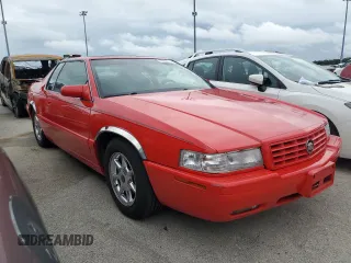 2002 Cadillac Eldorado z VIN 1G6EC129X2B106142, wystawiony jako Copart lot #74424164 z przebiegiem Nie podano mil oraz Szkody całkowita. Historia ofert i sprzedaży dostępna na DreamBid. Obrazek 4.