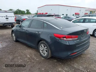 2016 Kia Optima LX with VIN KNAGT4L37G5070799, listed as a IAAI auction lot 41963239 with 116,308 mi miles. Bid and sale history available at carsss.com. Image 3.