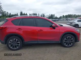 2016 Mazda CX-5 Grand Touring z VIN JM3KE4DY7G0687318, wystawiony jako IAAI lot #42228585 z przebiegiem 188 793 mil mil oraz . Historia ofert i sprzedaży dostępna na DreamBid. Obrazek 13.