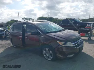2011 Honda Odyssey Touring with VIN 5FNRL5H97BB008759, listed as a IAAI auction lot 41567010 with 215,709 mi miles. Bid and sale history available at carsss.com. Image 6.
