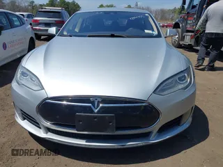 2015 Tesla Model S 85D with VIN 5YJSA1H2XFF084145, listed as a IAAI auction lot 42101755 with 105,660 mi miles. Bid and sale history available at carsss.com. Image 12.