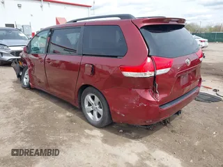 2014 Toyota Sienna LE AAS with VIN 5TDKK3DC4ES462090, listed as a IAAI auction lot 41942354 with 215,814 mi miles. Bid and sale history available at carsss.com. Image 3.