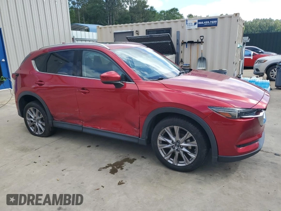 2019 Mazda CX-5 Grand Touring with VIN JM3KFADM2K1657915, listed as a Copart auction lot 56647145 with 85,095 mi miles and Salvage title. Bid and sale history available at DreamBid. Image 4.