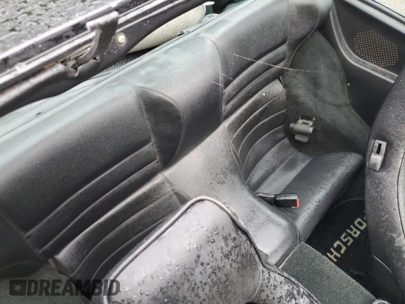 1987 Porsche 944 z VIN WP0AB0946HN474232, wystawiony jako Copart lot #64654684 z przebiegiem 87 126 mil mil oraz Szkoda całkowita • Salvage title. Historia ofert i sprzedaży dostępna na DreamBid. Obrazek 10.