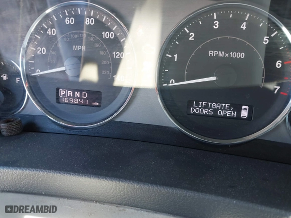 2009 Jeep Grand Cherokee Limited with VIN 1J8HR58P69C553747, listed as a IAAI auction lot 41860865 with 169,841 mi miles. Bid and sale history available at carsss.com. Image 7.