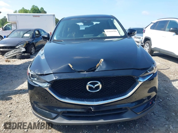 2017 Mazda CX-5 Touring z VIN JM3KFBCL0H0209458, wystawiony jako IAAI lot #42169599 z przebiegiem 93 287 mil mil oraz . Historia ofert i sprzedaży dostępna na DreamBid. Obrazek 12.