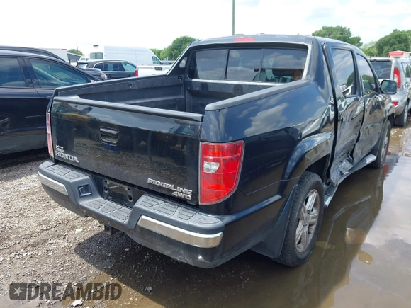 2011 Honda Ridgeline RTL with VIN 5FPYK1F54BB011472, listed as a IAAI auction lot 42112512 with 194,974 mi miles and . Bid and sale history available at DreamBid. Image 4.