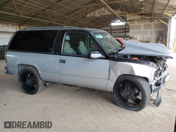 1998 Chevrolet Tahoe with VIN 3GNEC18R3WG122904, listed as a Copart auction lot 57752554 with 229,646 mi miles and Salvage title. Bid and sale history available at DreamBid. Image 4.