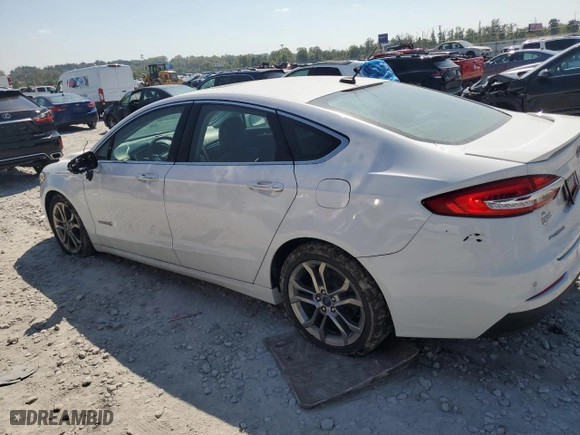 2019 Ford Fusion Hybrid Titanium with VIN 3FA6P0RU5KR277649, listed as a Copart auction lot 69391284 with 90,772 mi miles and Clean Title. Bid and sale history available at carsss.com. Image 2.