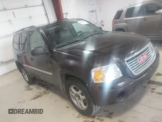 2008 GMC Envoy SLE2 with VIN 1GKDS13S682121604, listed as a IAAI auction lot 41613380 with 166,512 mi miles. Bid and sale history available at carsss.com. Image 1.