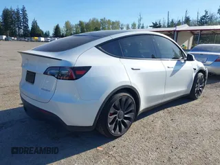 2023 Tesla Model Y Performance with VIN 7SAYGDEF2PF754938, listed as a IAAI auction lot 42067041 with 21,103 mi miles and . Bid and sale history available at DreamBid. Image 4.