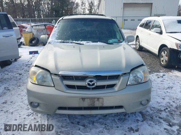 2006 Mazda Tribute LX with VIN 4F2YZ94126KM09467, listed as a IAAI auction lot 41324941 with 116,519 mi miles and . Bid and sale history available at DreamBid. Image 6.
