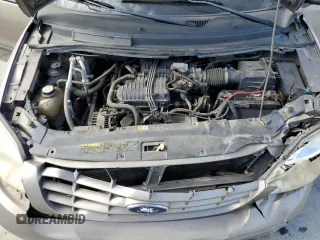 2005 Ford Freestar SE z VIN 2FMDA51635BA60614, wystawiony jako Copart lot #60058044 z przebiegiem 228 858 mil mil oraz Szkody całkowita. Historia ofert i sprzedaży dostępna na DreamBid. Obrazek 13.