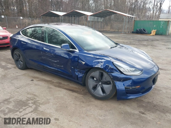 2019 Tesla Model 3 Mid Range with VIN 5YJ3E1EA5KF299589, listed as a IAAI auction lot 41709733 with 50,256 mi miles and . Bid and sale history available at DreamBid. Image 1.