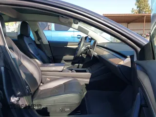 2023 Tesla Model 3 with VIN 5YJ3E1EA7PF447409, listed as a IAAI auction lot 41965416 with 40,033 mi miles and . Bid and sale history available at DreamBid. Image 5.