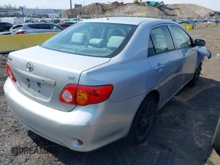 2010 Toyota Corolla with VIN 1NXBU4EE6AZ372196, listed as a IAAI auction lot 42008050 with 68,524 mi miles. Bid and sale history available at carsss.com. Image 4.