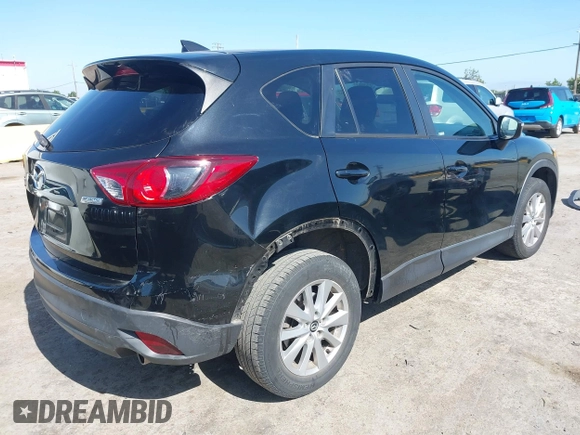 2016 Mazda CX-5 Touring z VIN JM3KE4CY2G0656270, wystawiony jako IAAI lot #42344489 z przebiegiem 60 449 mil mil oraz . Historia ofert i sprzedaży dostępna na DreamBid. Obrazek 4.