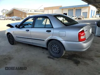 2002 Mazda Protege DX with VIN JM1BJ225120605237, listed as a Copart auction lot 49331225 with 184,556 mi miles and Salvage Title. Bid and sale history available at DreamBid. Image 2.