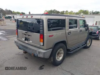 2003 Hummer H2 with VIN 5GRGN23U73H142389, listed as a IAAI auction lot 42219627 with 78,547 mi miles. Bid and sale history available at carsss.com. Image 4.