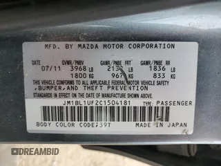 2012 Mazda 3 i Sport z VIN JM1BL1UF2C1504181, wystawiony jako Copart lot #56019085 z przebiegiem 181 946 mil mil oraz Szkoda całkowita • Salvage title. Historia ofert i sprzedaży dostępna na DreamBid. Obrazek 12.